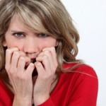 Woman biting her nails because of FUD about her marketing